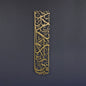 Decorative wall art with Arabic calligraphy on a dark background